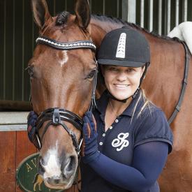 A woman and her horse. She is wearing navy blue IceRays Sun Sleeves for Maximum sun protection while horseback riding. Horse-Riding A woman and her horse. She is wearing navy blue IceRays Sun Sleeves for Maximum sun protection while horseback riding. Horse-Riding