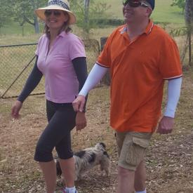 A couple out for a walk with their dog, and both the man and the woman are wearing IceRays Sun Sleeves for Maximum UV sun protection while hiking. Walking A couple out for a walk with their dog, and both the man and the woman are wearing IceRays Sun Sleeves for Maximum UV sun protection while hiking. Walking